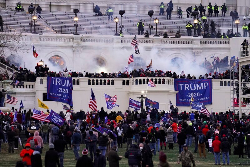 Violent protesters, loyal to President Donald Trump, storm the Capitol on Jan. 6, 2021, in Washington. (AP Photo/John Minchillo)